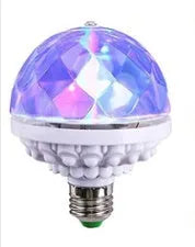 LED colourful rotating magic ball light with 6 RGB beads and lamp holder on a table