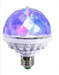 LED colourful rotating magic ball light with 6 RGB beads and lamp holder on a table