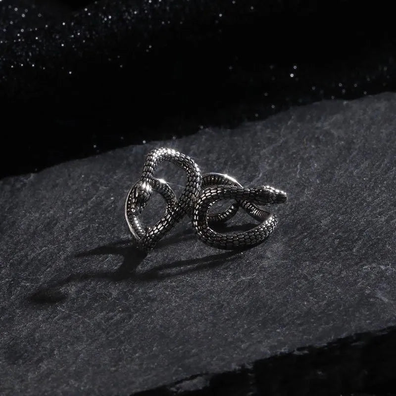 Retro snake-shaped alloy ear clip with electroplated finish on a neutral background