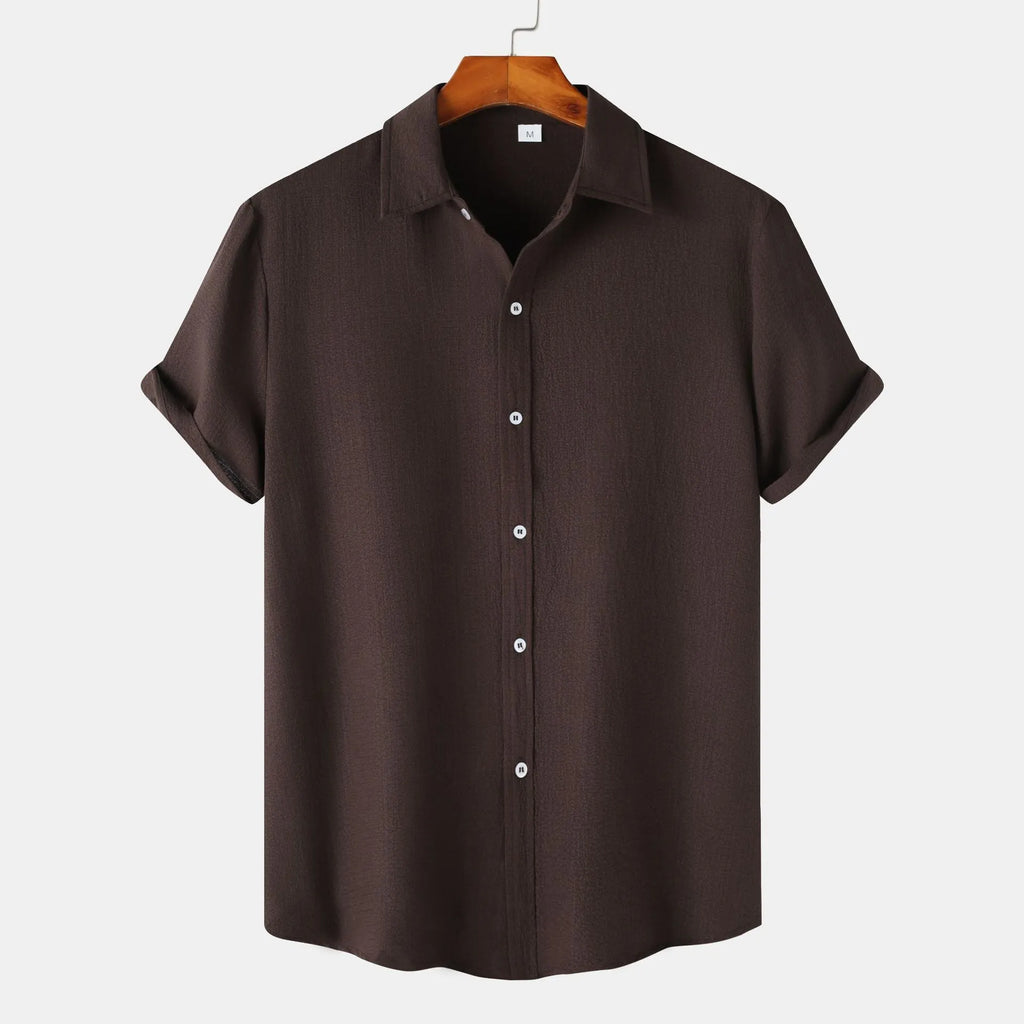 Man wearing a casual short-sleeved polyester shirt in a cardigan style, available in multiple colours.