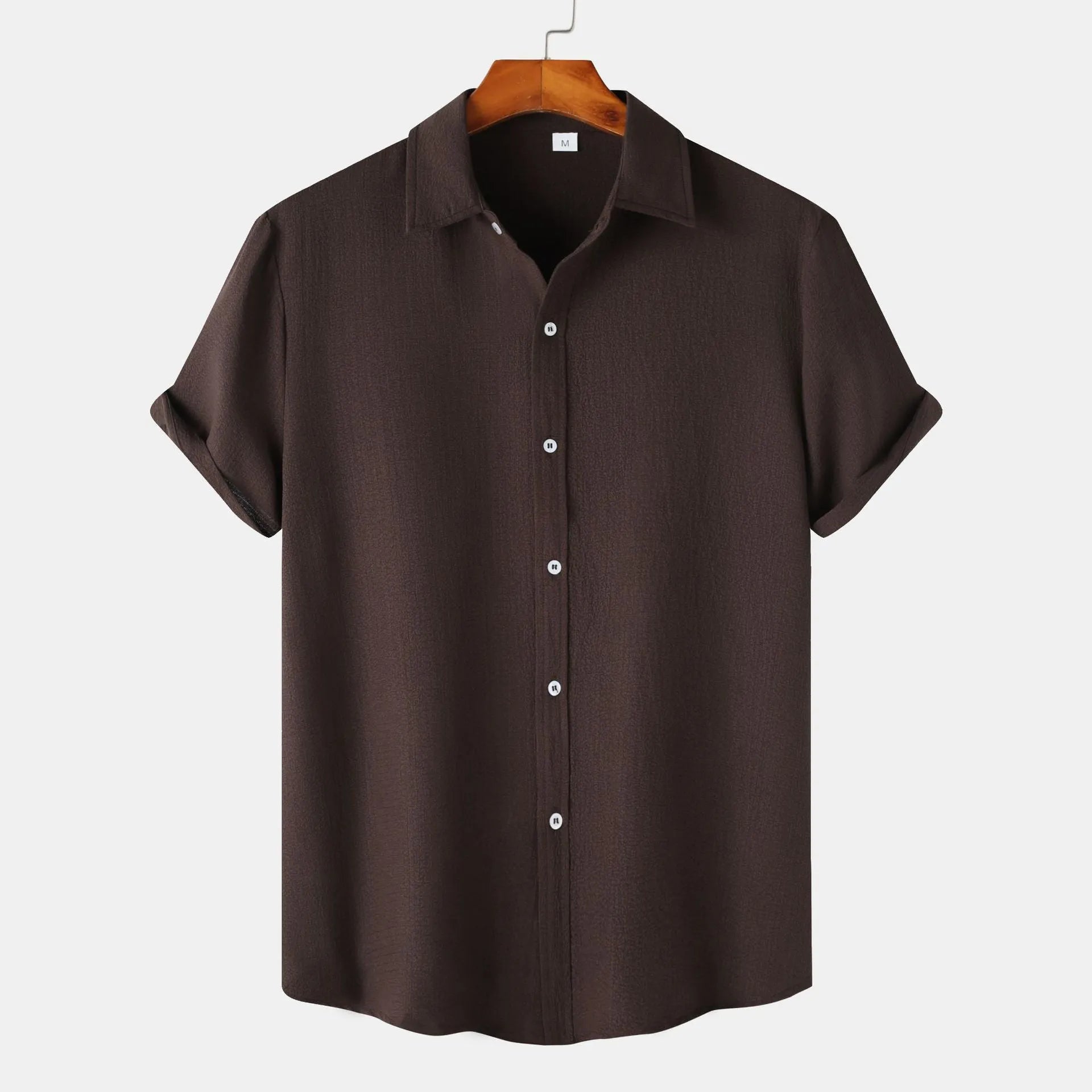 Man wearing a casual short-sleeved polyester shirt in a cardigan style, available in multiple colours.