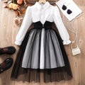 Girls mesh stitching dress in solid colour polyester, available in black and brown for heights 8Y to 12Y