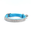 Adjustable velvet cat collar with rhinestones in red, blue, purple, black, or pink.