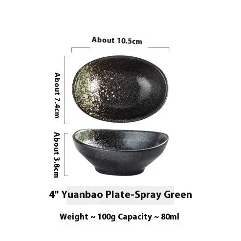 Oval Japanese ceramic dipping sauce bowl with Edo Pattern design on a dark surface.