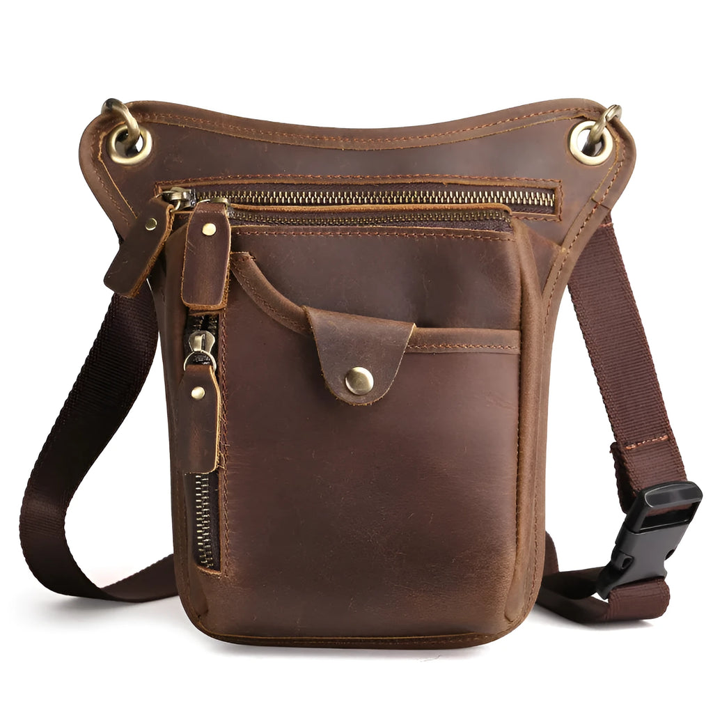 Men's brown Crazy Horse leather retro satchel bag with flap closure on a table.