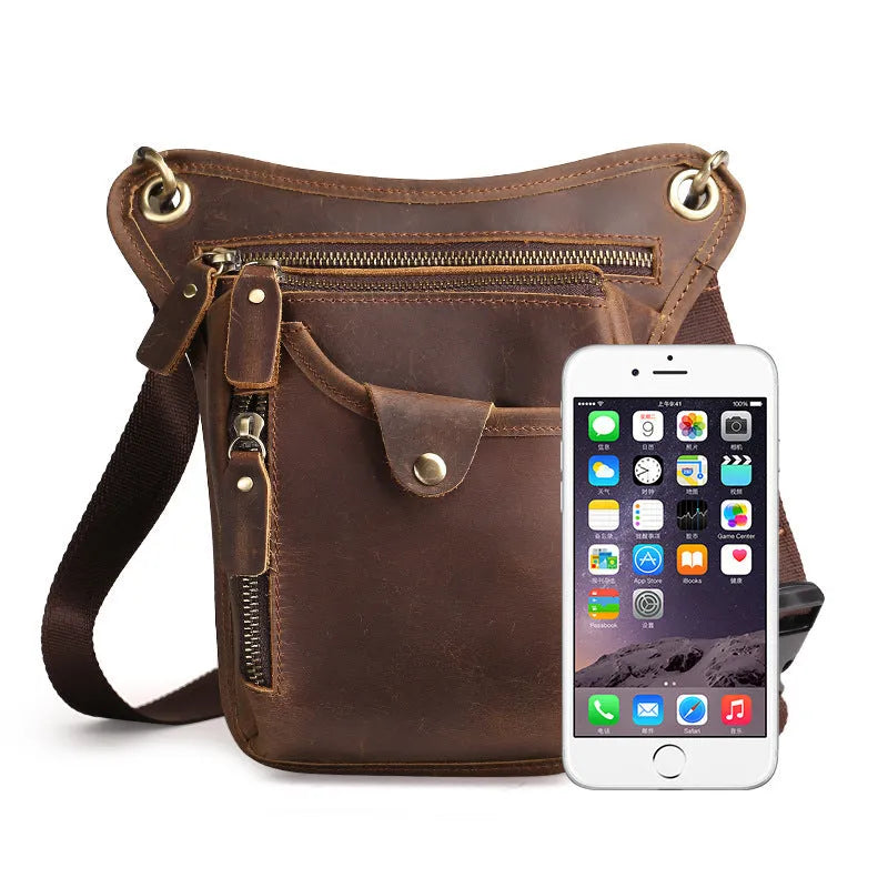 Men's brown Crazy Horse leather retro satchel bag with flap closure on a table.