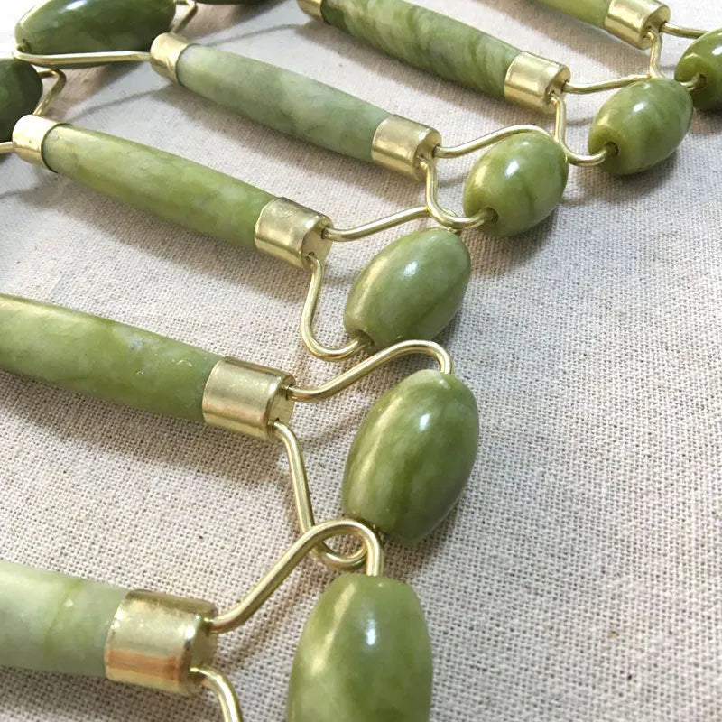 Double-end jade roller with natural Xiuyu jade, 14cm total length, 4.5cm large wheel and 2.2cm small wheel, green colour