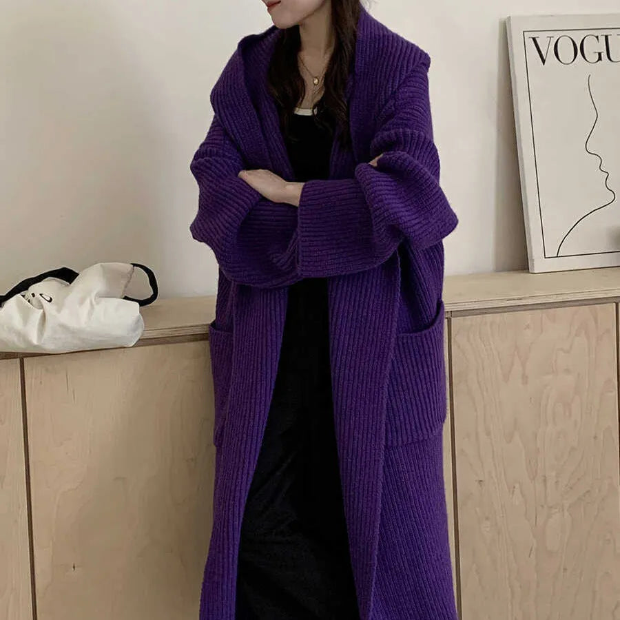 Women's loose grey hooded longline acrylic cardigan coat with raglan sleeves laid flat