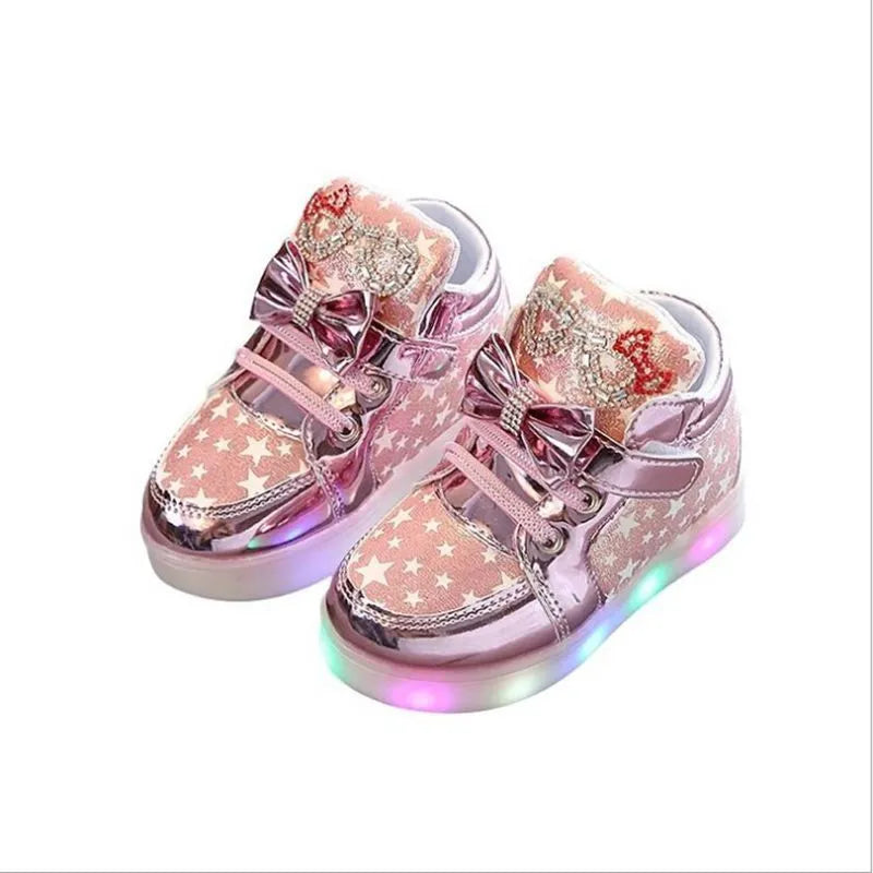Children's LED light-up trainers with glowing rainbow soles in golden, pink and silvery colours