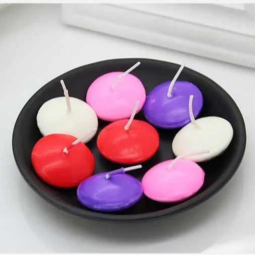 Pack of 10 floating candles in ivory white, red, pink, pure white, and yellow, cylindrical paraffin wax