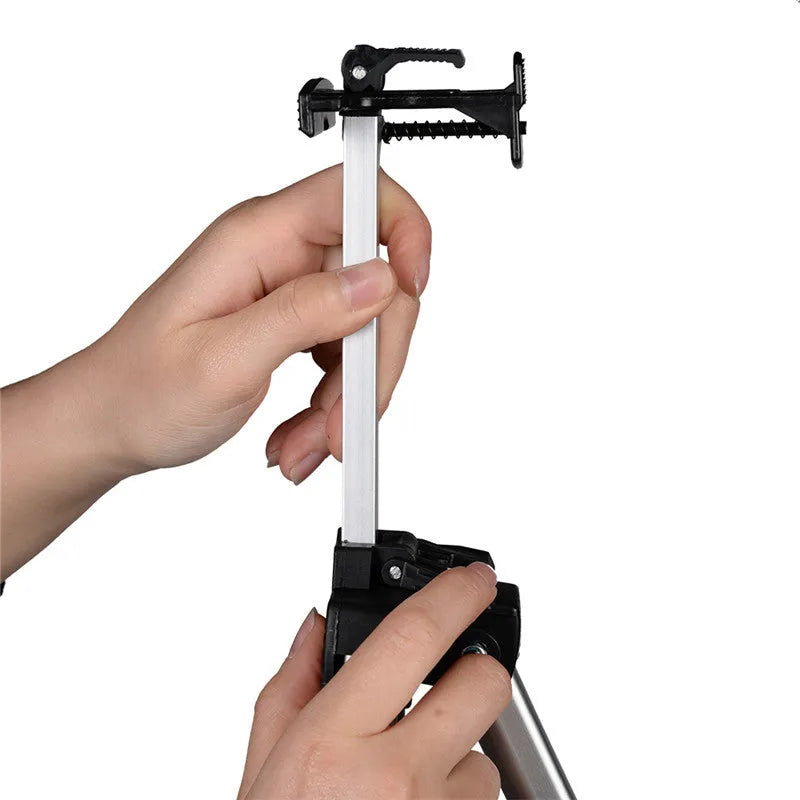 Silver aluminium alloy adjustable easel with metal tray, collapsed for table top use, next to a black nylon carrying bag