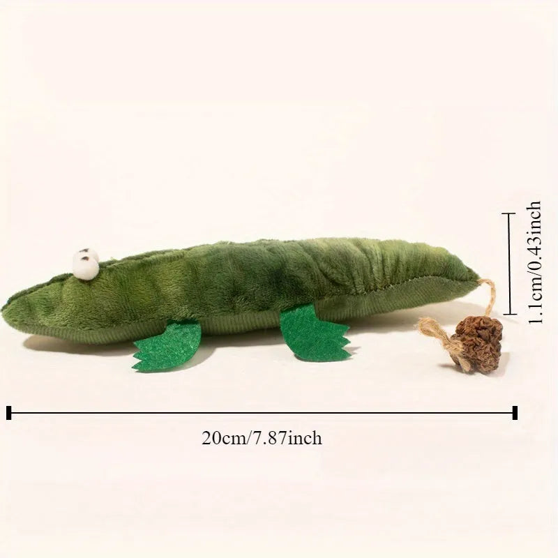 Green plush alligator cat toy with plant-based materials and peppermint scent for oral care