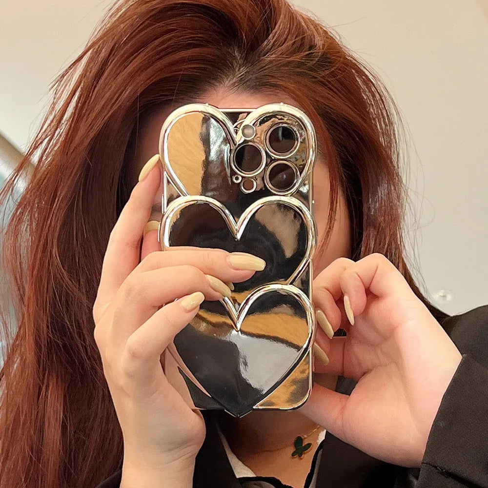 Soft TPU iPhone case with a silver electroplated love design on the back, shown next to a matching bracelet.