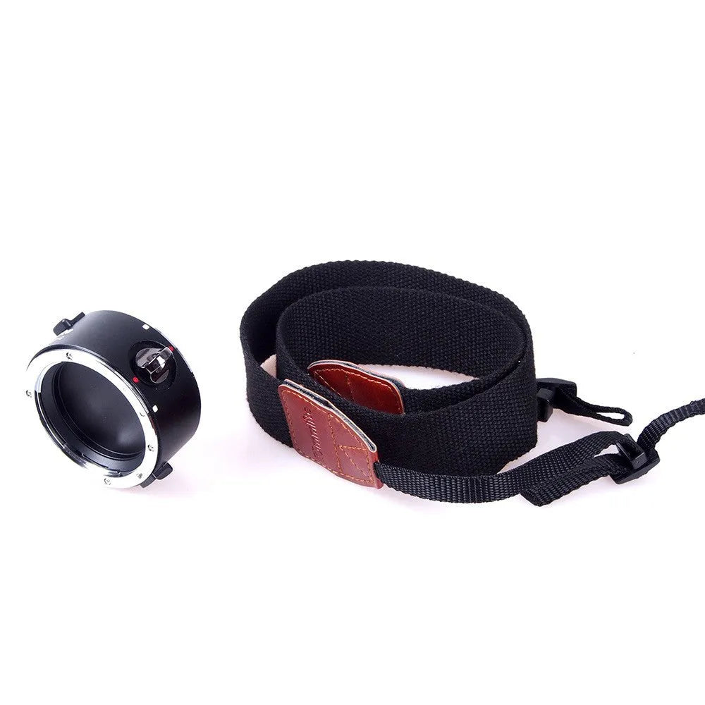 Aluminium camera lens flipper holder with cotton shoulder strap for Canon, Nikon, or Sony cameras.