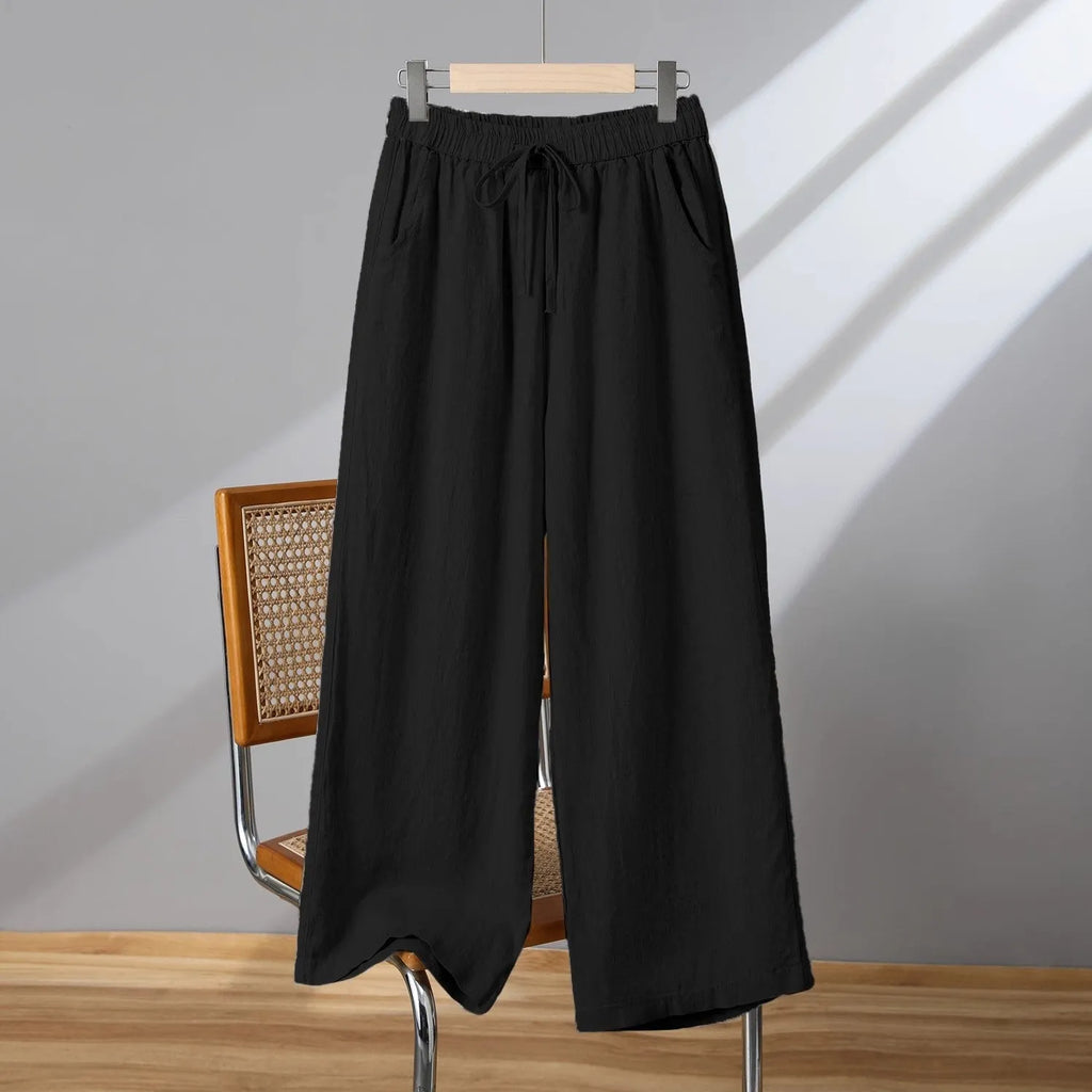 Women's apricot-coloured straight-leg casual trousers with an elastic waistband and white lace-up drawstring detail.