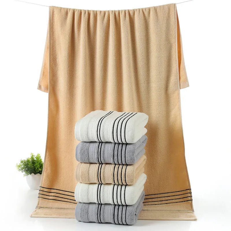 Cotton bath towel set showing hand towel and bath towel sizes in grey colour