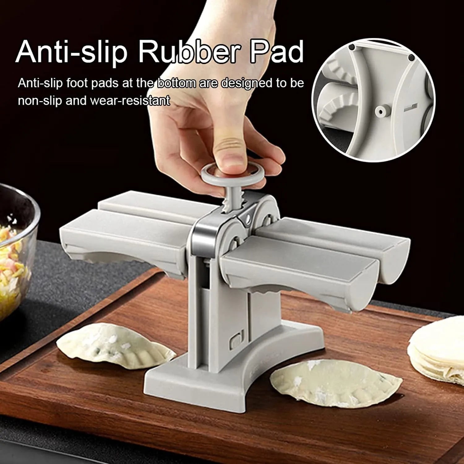 White double head manual dumpling press mould with anti-slip rubber base on kitchen counter.