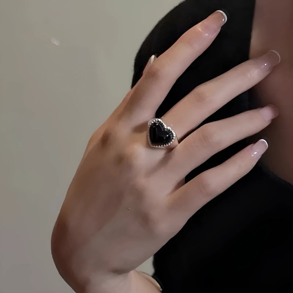Adjustable sterling silver ring with heart-shaped black agate in open-mouth design