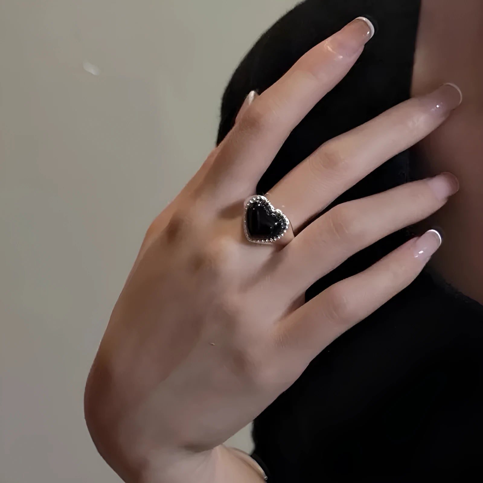 Adjustable sterling silver ring with heart-shaped black agate in open-mouth design