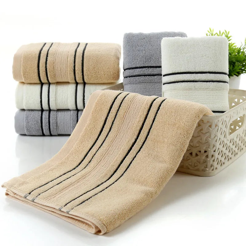 Cotton bath towel set showing hand towel and bath towel sizes in grey colour