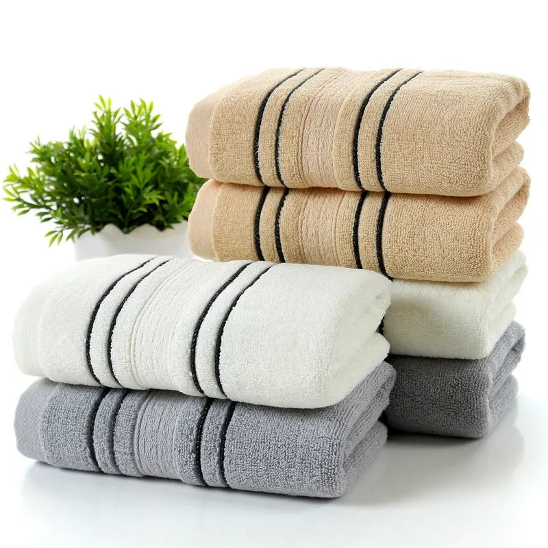 Cotton bath towel set showing hand towel and bath towel sizes in grey colour