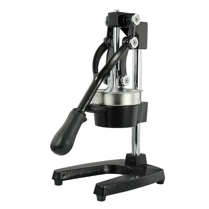 Black cast iron manual citrus juicer with stainless steel strainer on a kitchen counter.