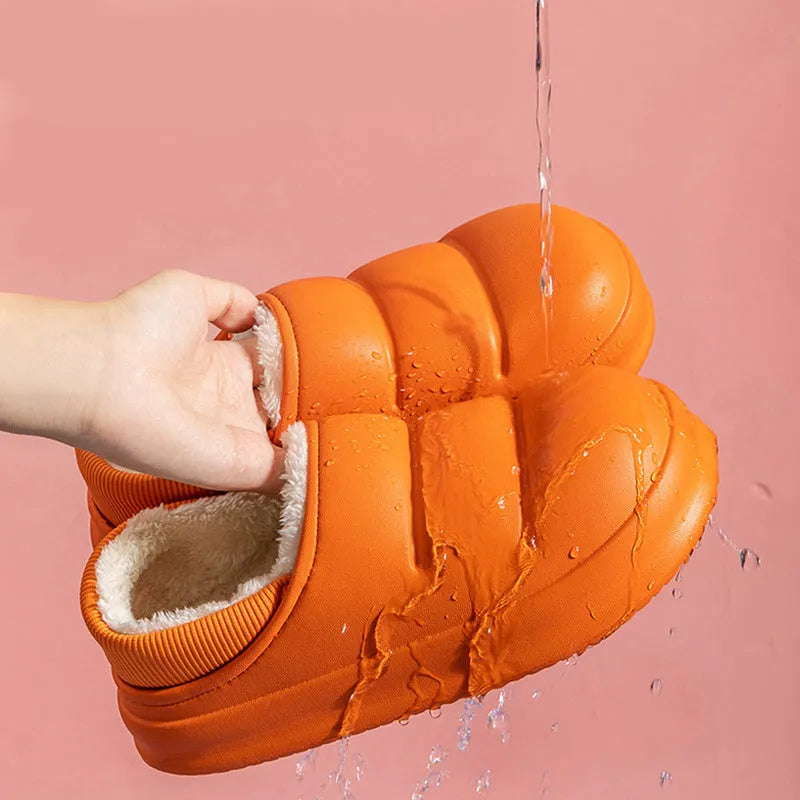 A pair of waterproof EVA garden slippers with a plush lining, shown in a solid colour with a non-slip sole.