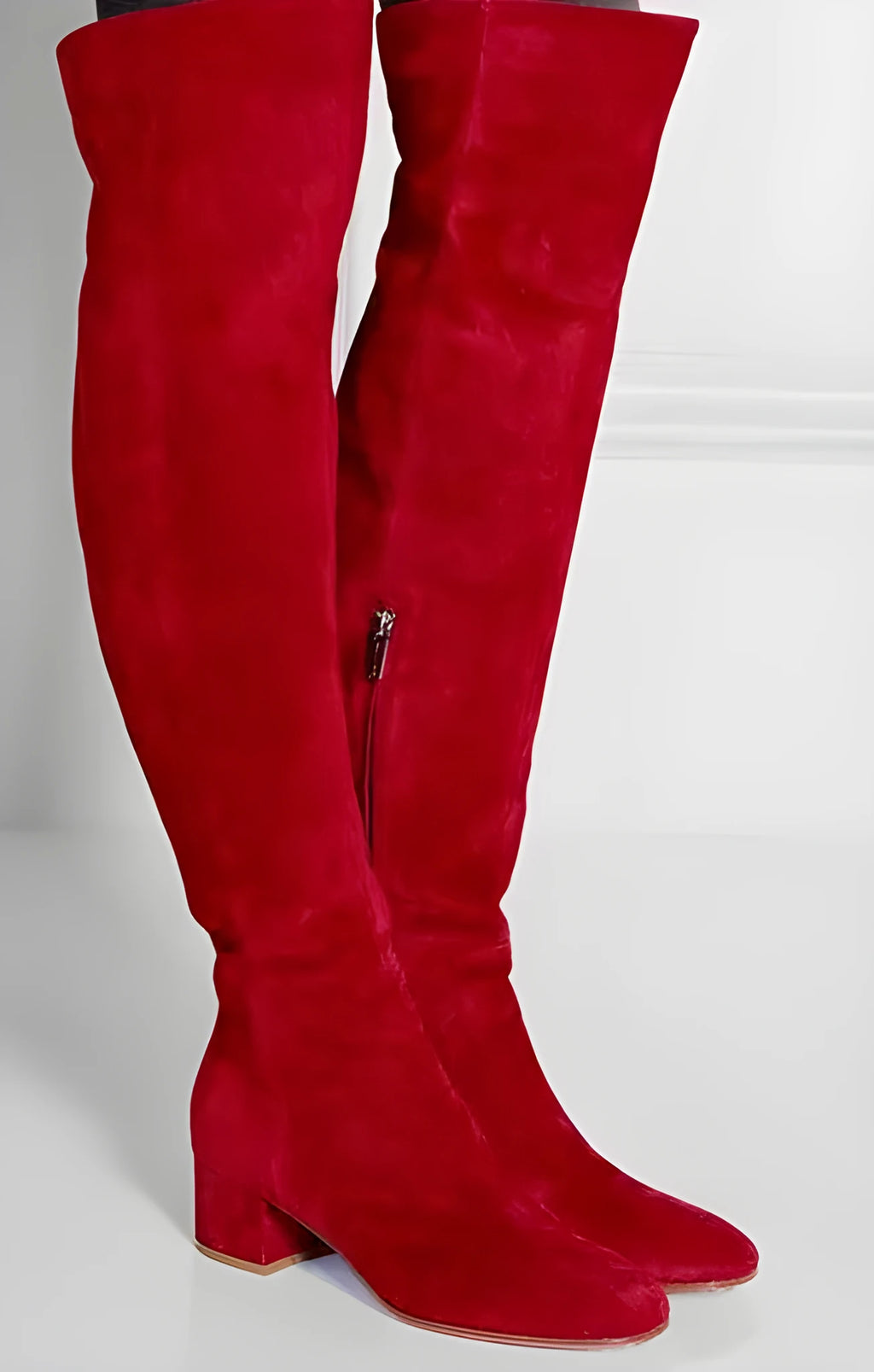 Grey women's suede over-the-knee boots with a flat thick heel and pointed toe.
