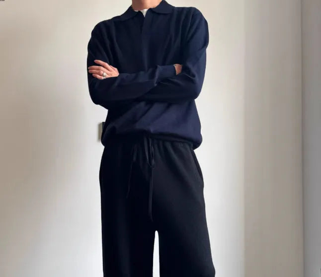 Pure wool polo sweater with lapel collar in loose fit, shown in navy blue colour.