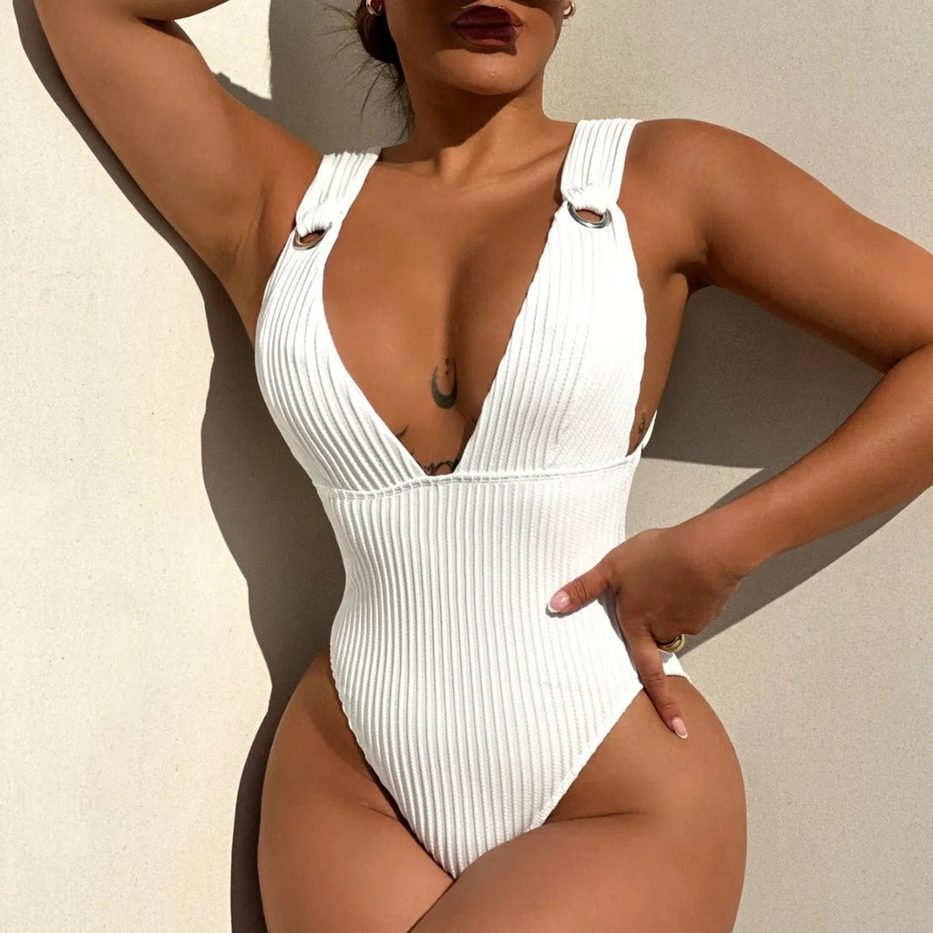 Solid colour one-piece swimsuit for women in black, white, green, or orange.