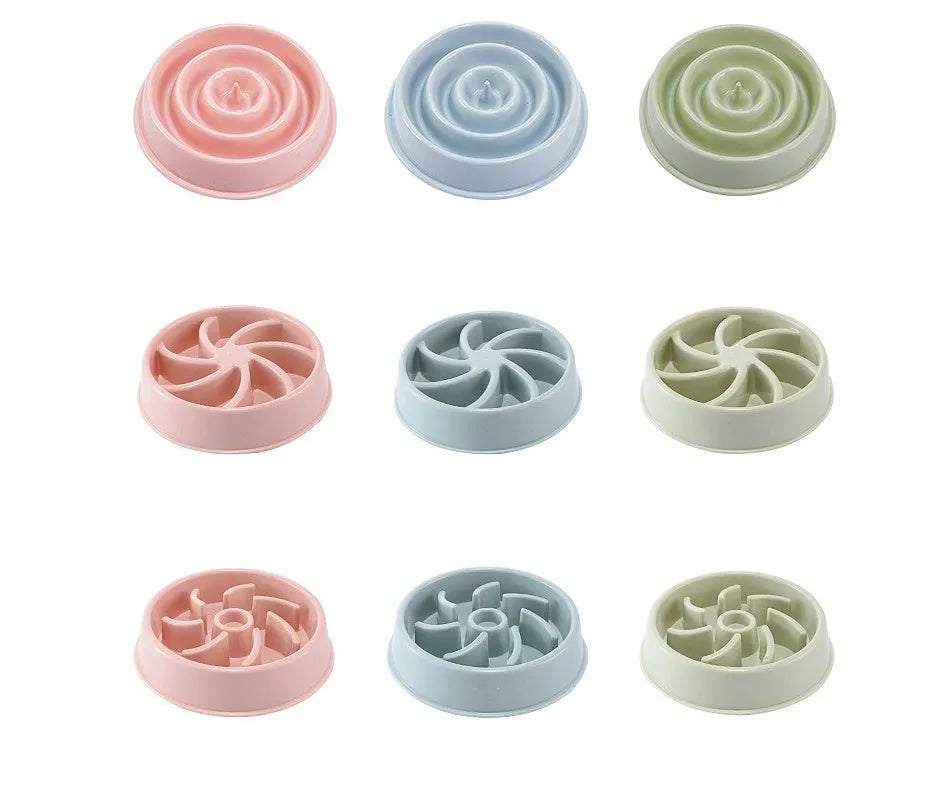 Plastic slow food bowl for dogs and cats with flower-shaped internal obstacles, pink colour, choke prevention design.