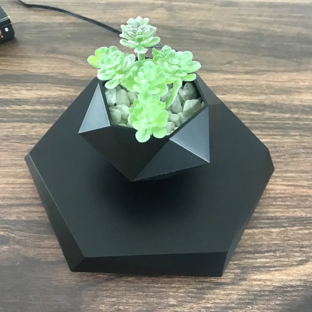 Hexagonal wood grain plant pot floating above circular base with magnetic levitation