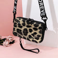 Mini suitcase mobile phone bag in horizontal square shape with single strap, zip closure, PVC outer and polyester lining.