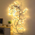 Warm white LED tree decorative light with rattan-style string and choice of plug type.