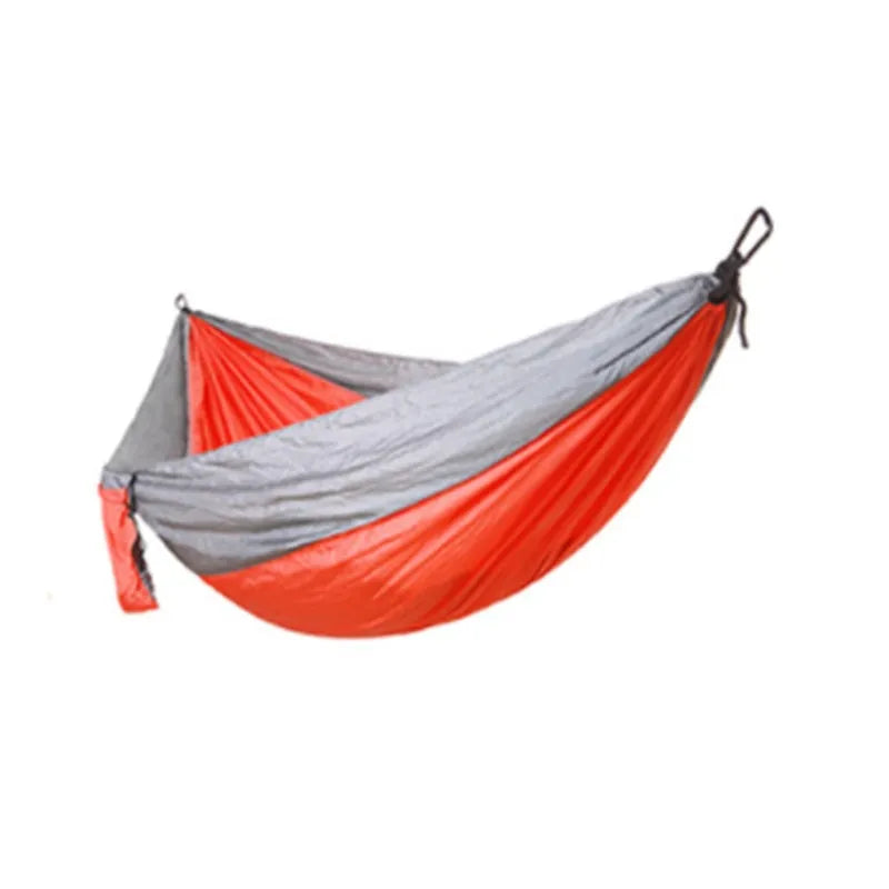 Double widened camping hammock 275x140cm in 210T nylon parachute fabric with steel buckles and ropes, shown outdoors in a garden setting