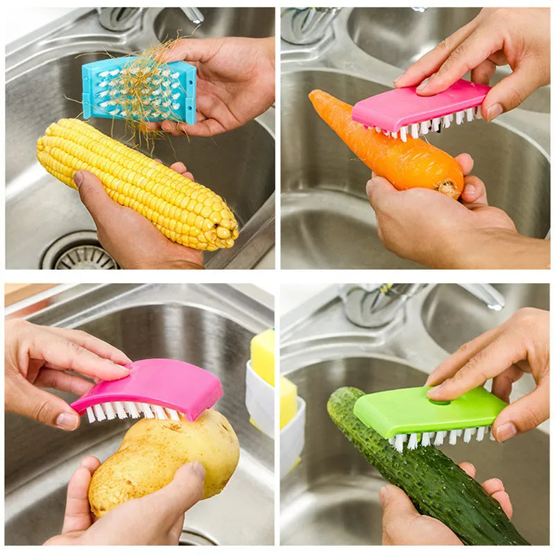 Blue kitchen cleaning brush with slots for utensils and a suction cup on a white wall.