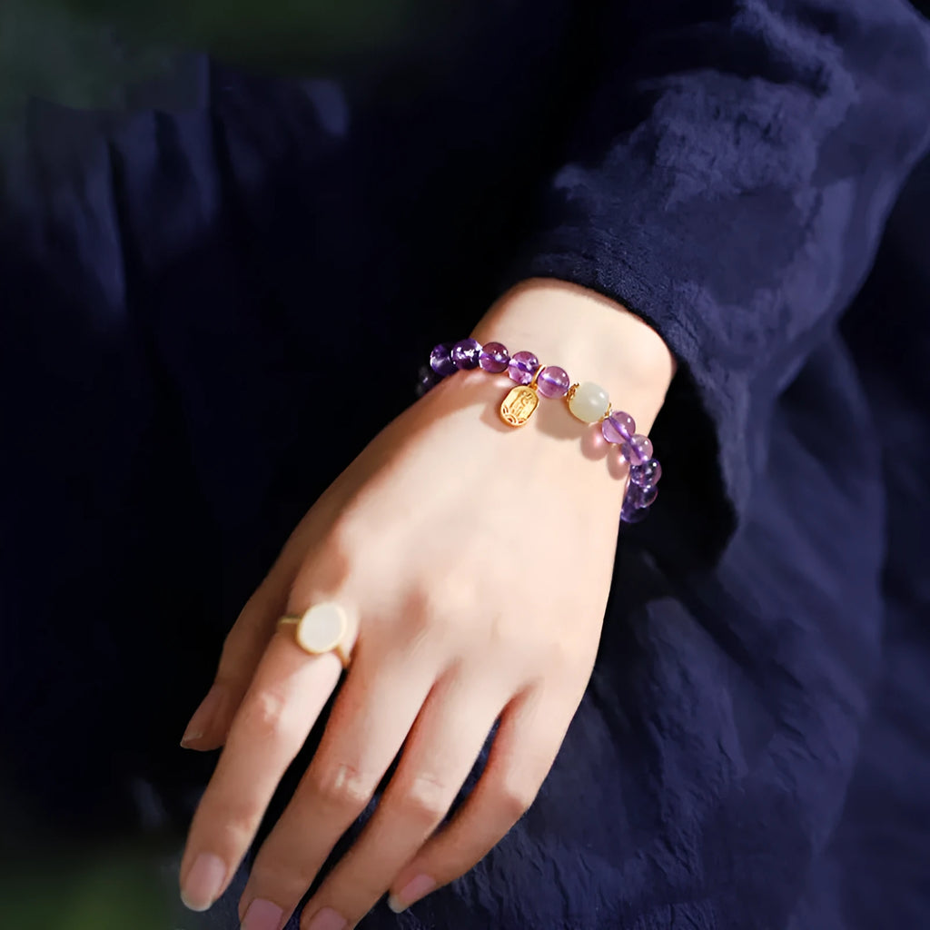 Amethyst colour crystal bracelet with 8mm beads in geometric pattern