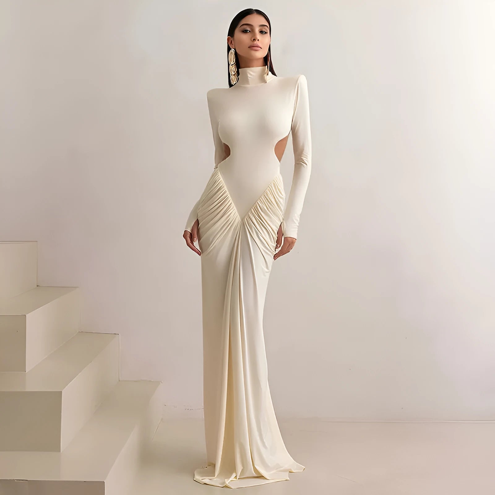 Women's long sleeve high collar slim fit dress with pleated backless detail in apricot colour.