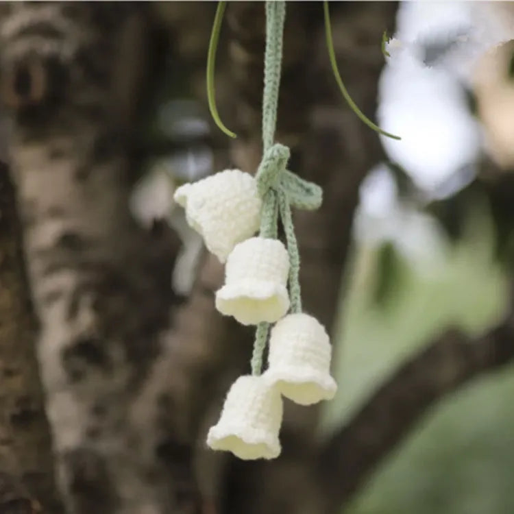 Green and white knitted wool plant ornament for car dashboard with hanging cord