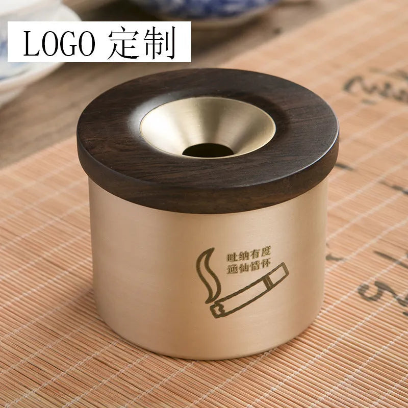 Copper retro ashtray with wooden lid showing central hole for ash collection