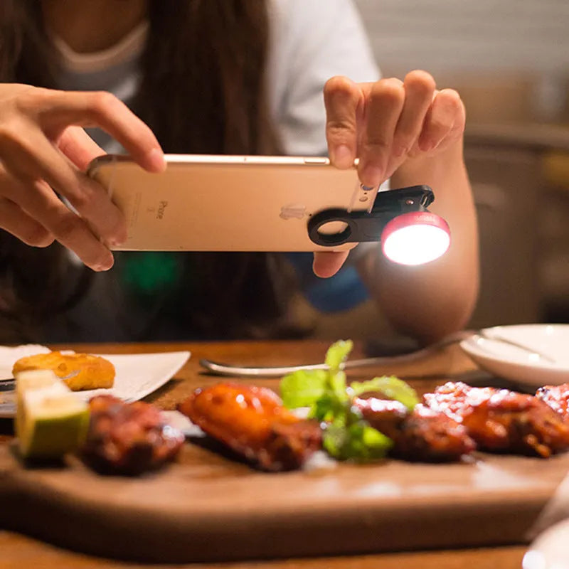 External mobile phone camera lens attachment with wide-angle capability and coloured LED lighting