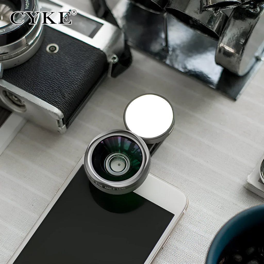 External mobile phone camera lens attachment with wide-angle capability and coloured LED lighting
