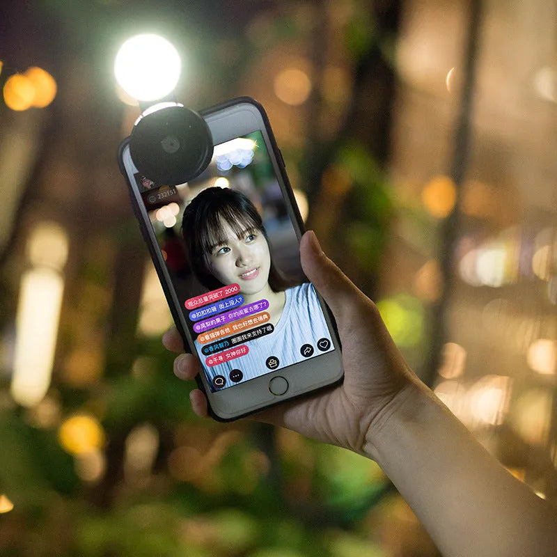 External mobile phone camera lens attachment with wide-angle capability and coloured LED lighting