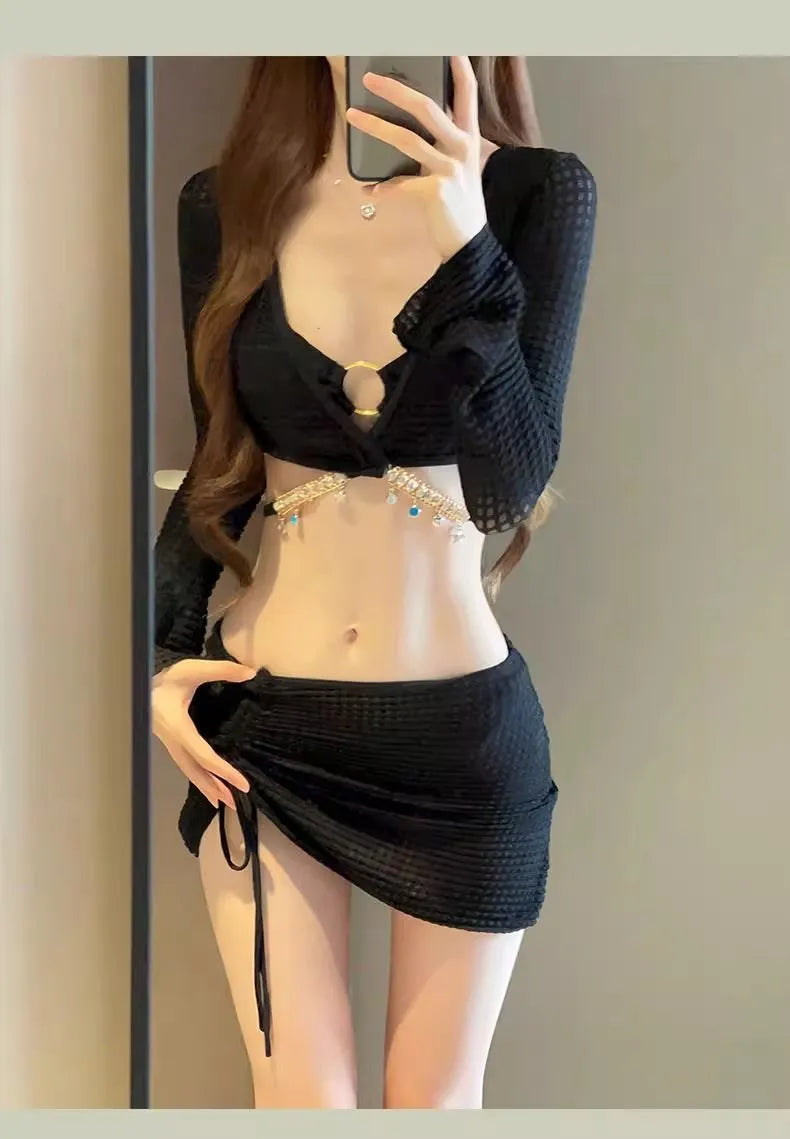 Women's long sleeve black and white bikini swimsuit made from polyester fabric