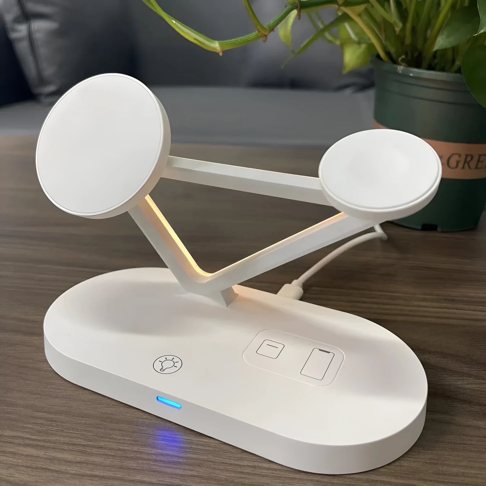 Black and white 3-in-1 wireless charging station for Apple Watch, AirPods and mobile phone.