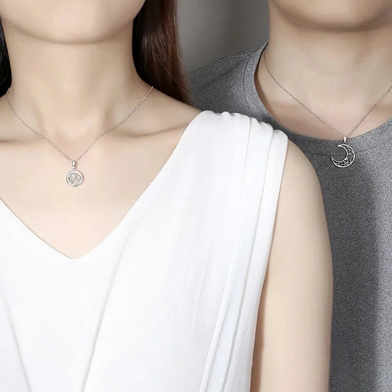 Copper sun and moon couple necklace with electroplated finish and cross chain.