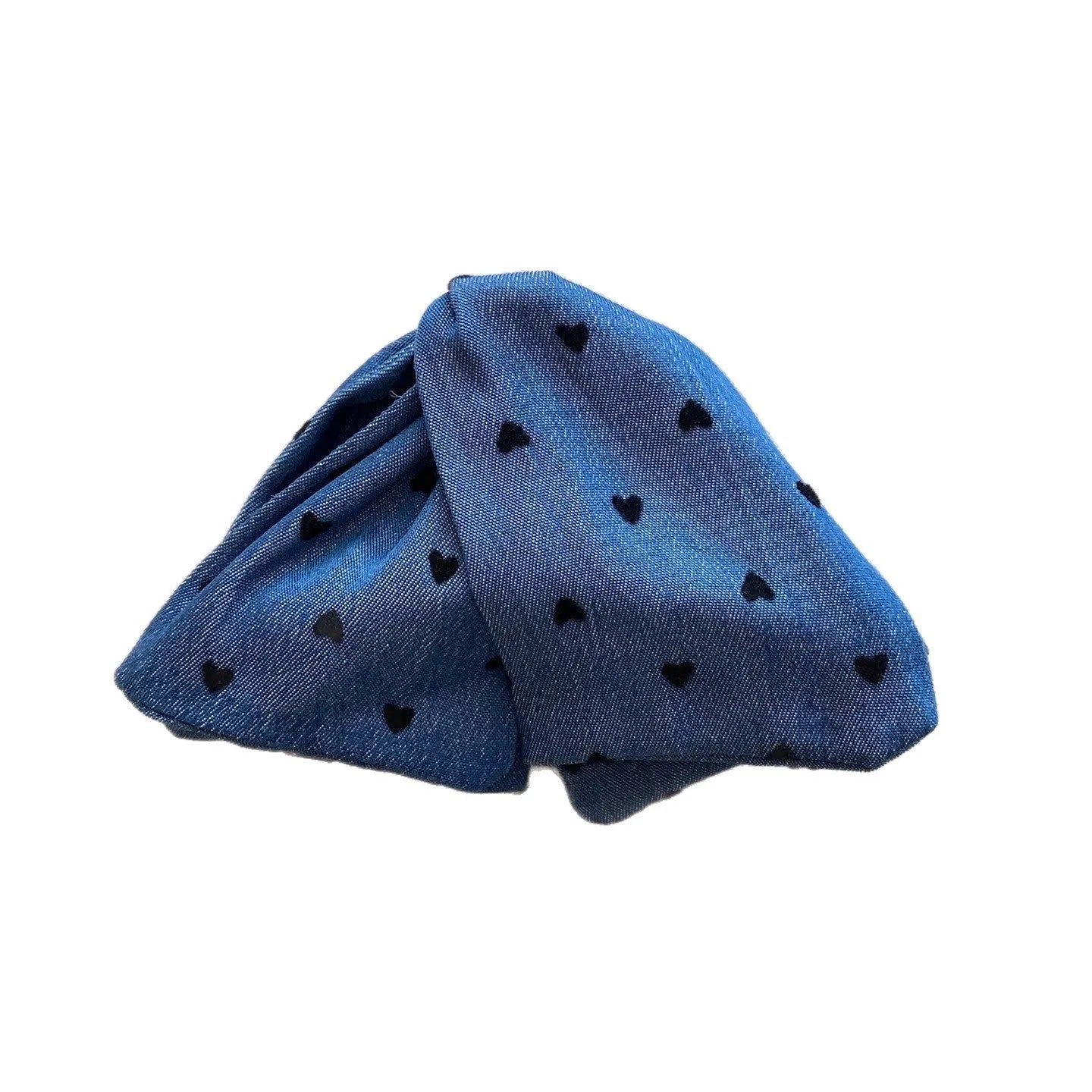 Handmade triangle-shaped hair clip for women in fabric and acrylic, showing plastic grip.