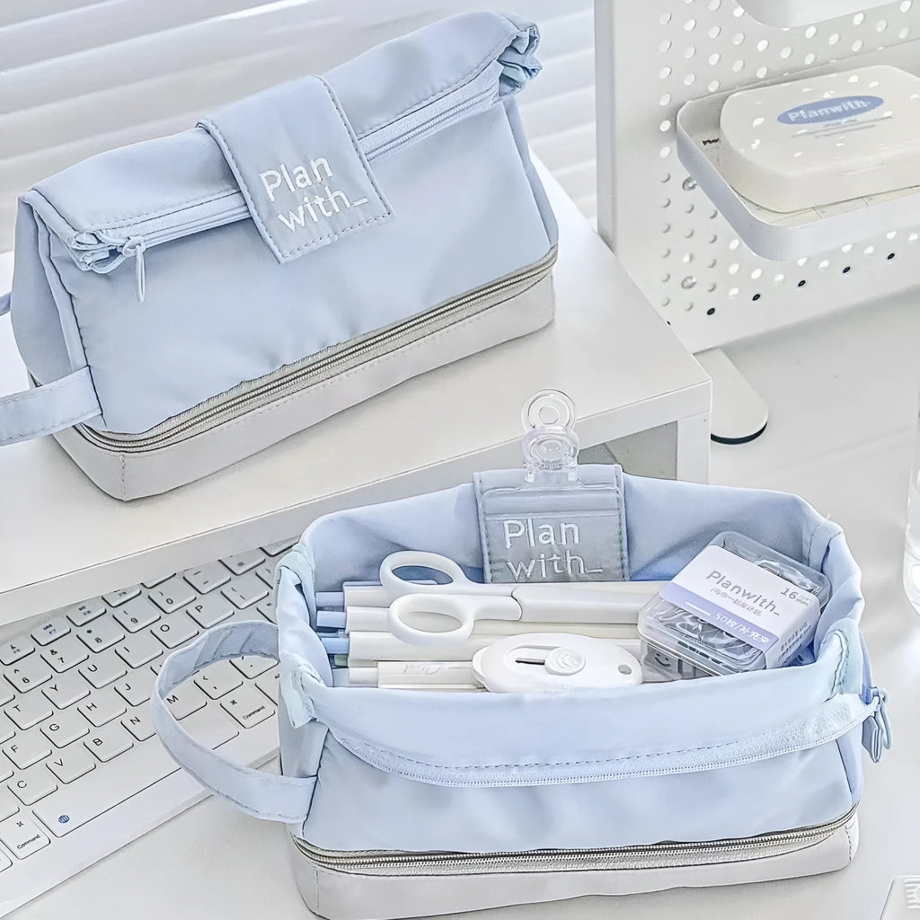 Folding double layer student pencil case in navy blue, blue, and cream white colours made from polyester.