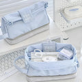 Folding double layer student pencil case in navy blue, blue, and cream white colours made from polyester.