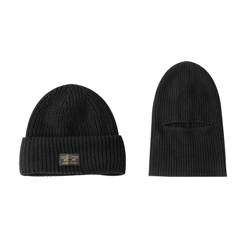 Vintage knitted melon skin warm beanie in black with patch detail on model wearing street-style outfit